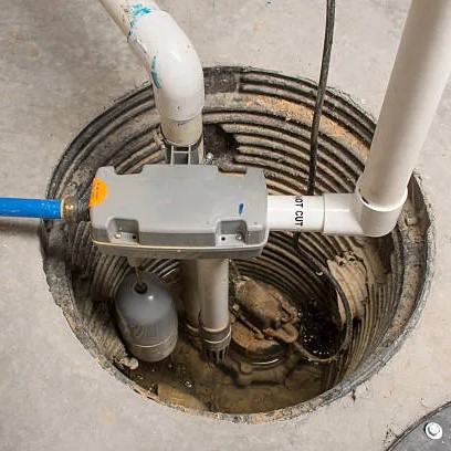 Basement sump pump installation to prevent flooding in Auburn home